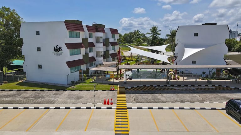 Modern school facilities featuring distinctive white facades and functional outdoor shade structures.