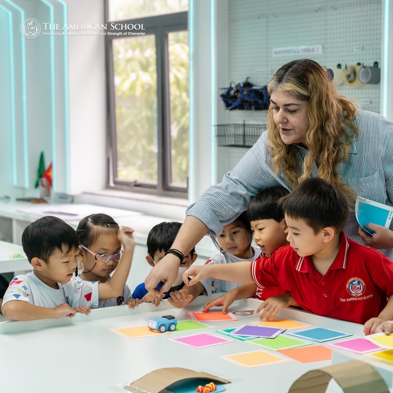 Young learners engaging with coding activities in a robotics class.