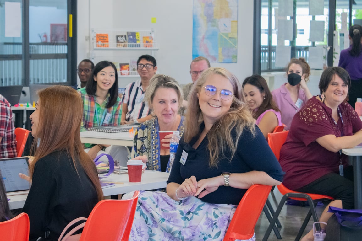 Teachers engaging in collaborative learning at the MYIS IB Cluster Workshop.