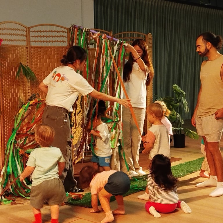 Families supporting children at an interactive art event.