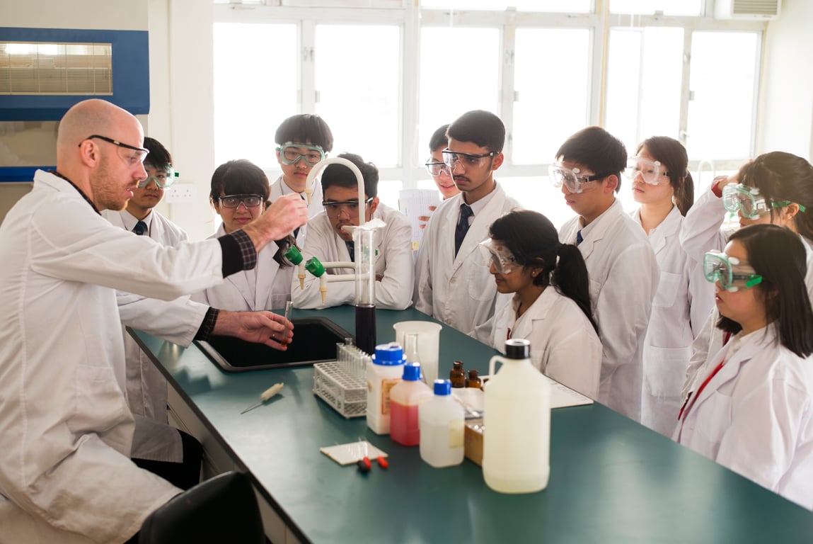 Students conducting a chemistry experiment during a lab session.