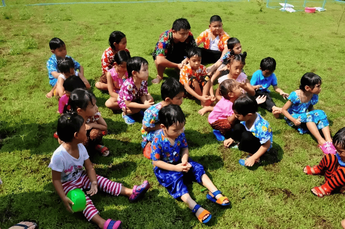 Students gathered outdoors during a cultural celebration.