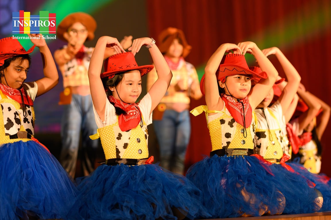 Students performing in the school musical with storybook-themed dances.