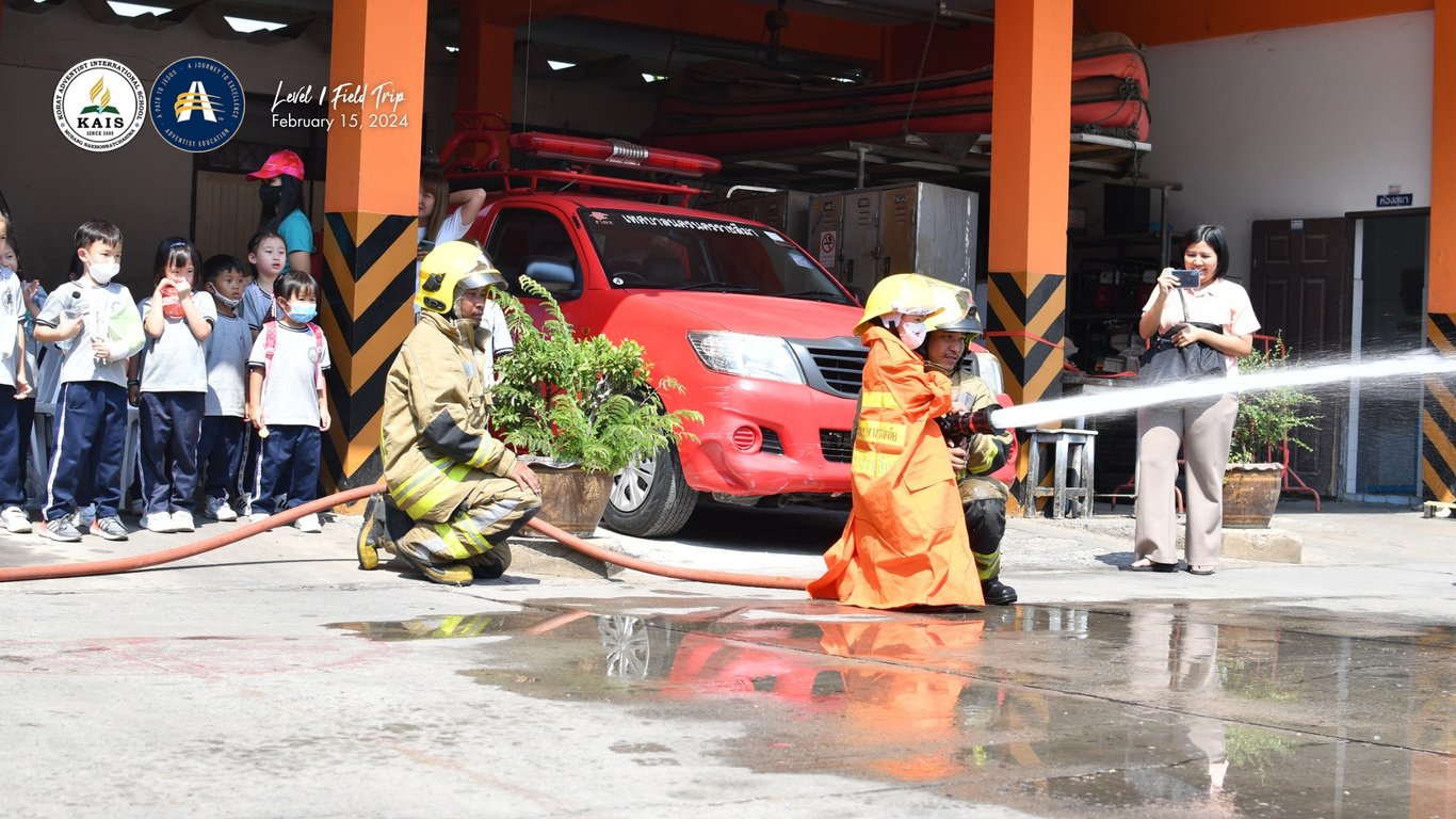 Level 1 students exploring firefighting during a community helpers trip.