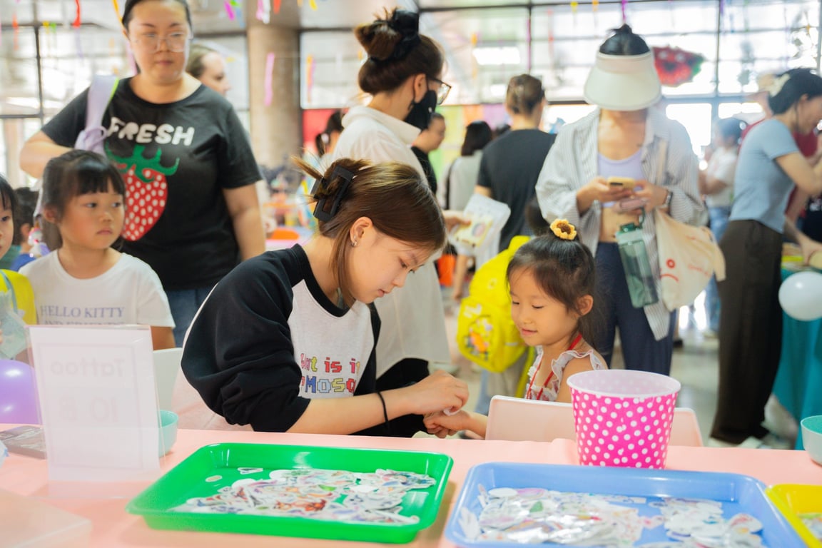 Parents and children enjoying the ECC Charity Market together.