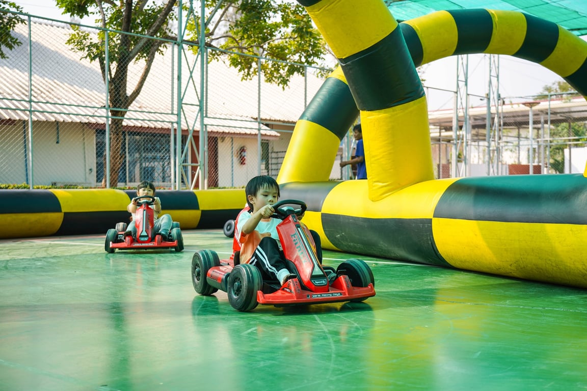 Kinder Camp students enjoying go-kart racing on the last day.