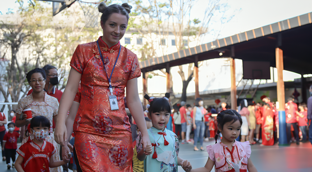 Students and staff celebrating Chinese New Year with a campus parade.