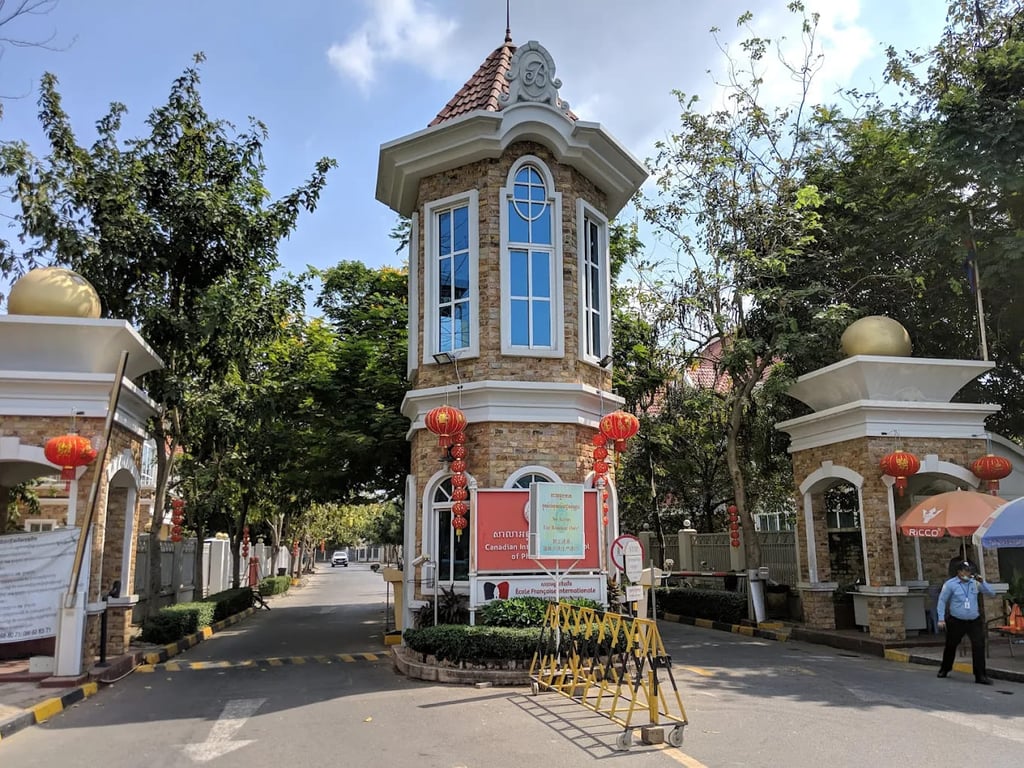 An exterior view of the school’s classical guardhouse and primary entrance drive.