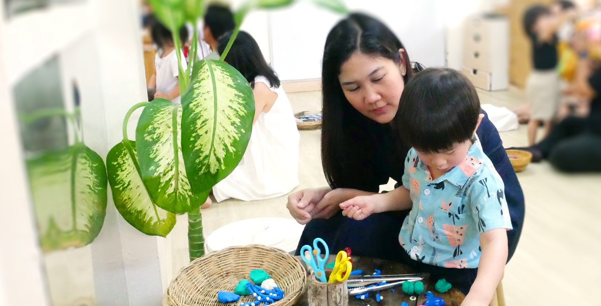 A mother and son at a stay & play session.