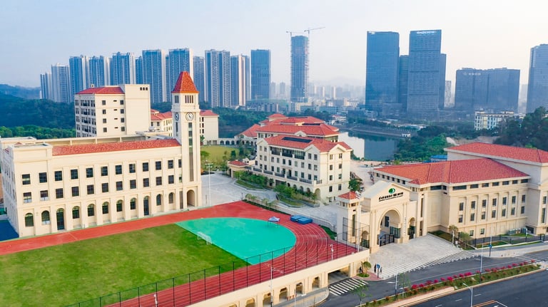 An aerial view of the expansive Shenzhen Foreign Languages GBA Academy campus buildings.