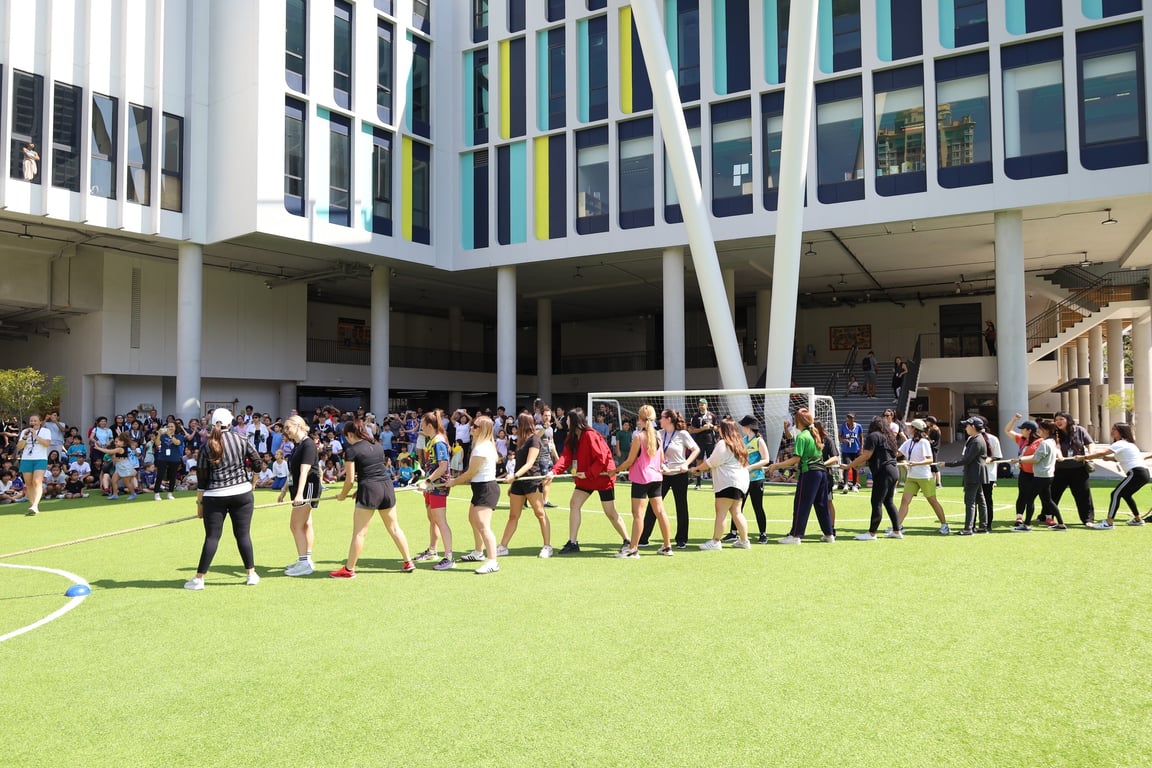 Families competing in a tug-of-war during the FSB Physical Fun Day.