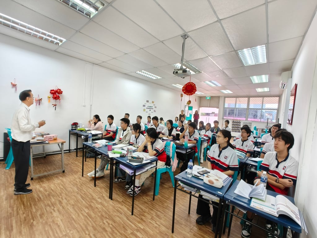 Assistant General Manager Mr. Woo Kin delivering a lesson on Singapore's laws and legislation