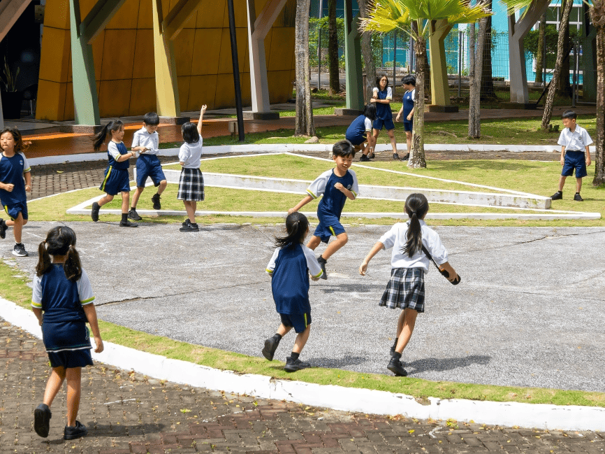 Students make the most of their break time with fun and games in the courtyard.