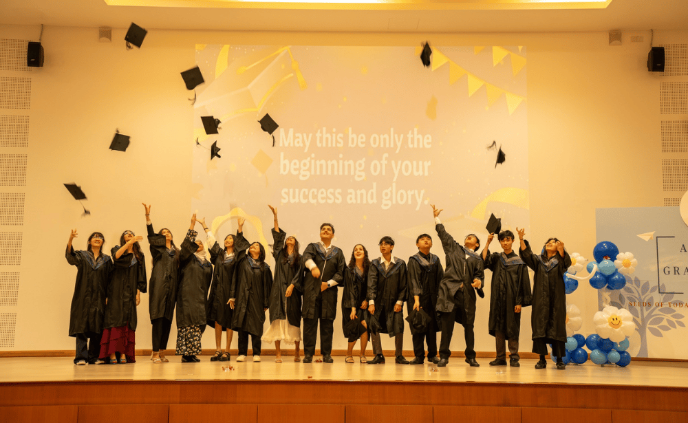 Graduates tossing their caps in celebration during the awards ceremony.