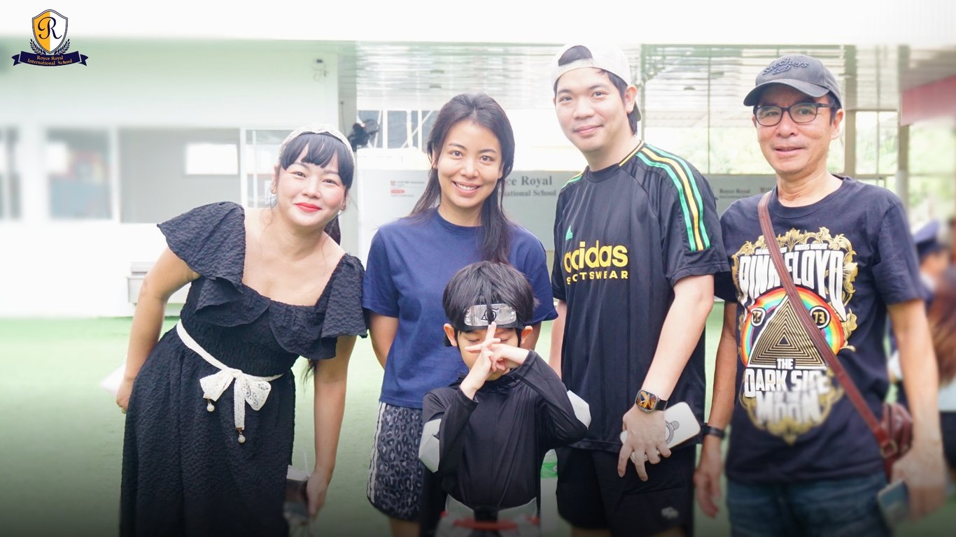 Family posing with their child dressed up for his perfomance.
