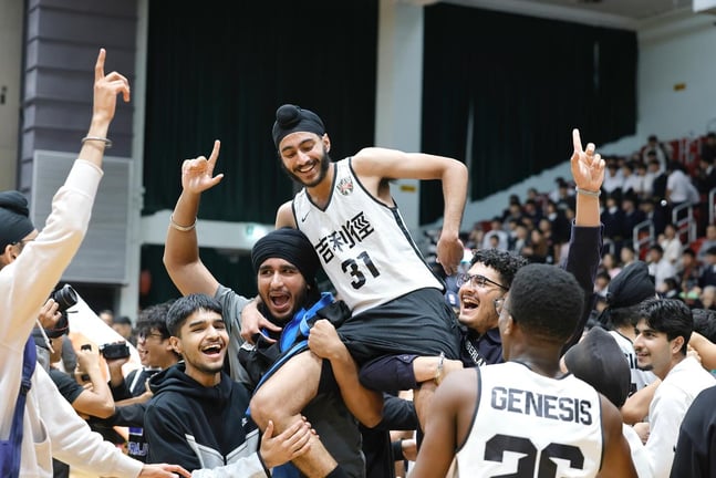 Basketball teammates celebrating victory after the final match.