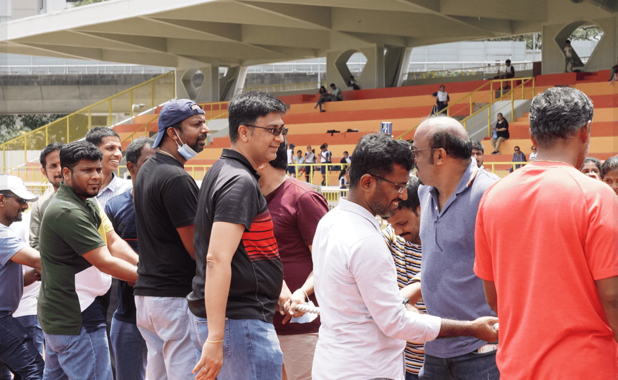 Parents taking part in activities on sports day.