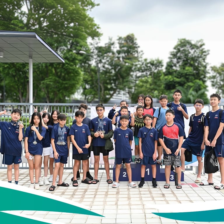 Stamford Lions swim team posing after a successful competition.