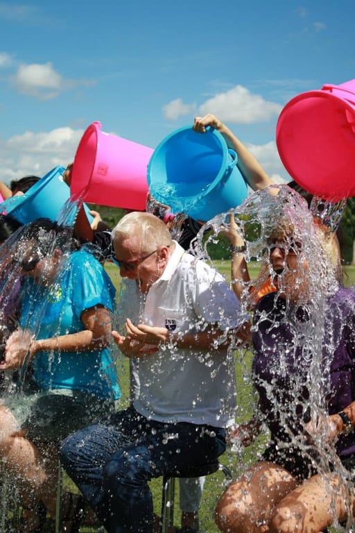 Buckets of water poured during Ice Bucket Challenge event.