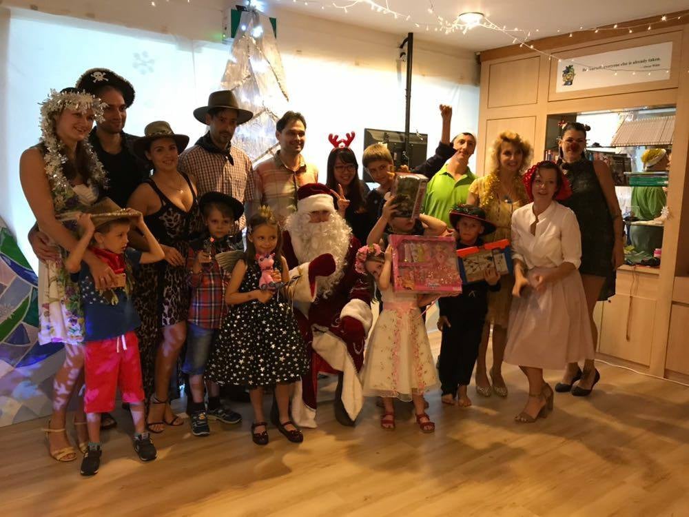 Parents, students and teachers dress up for festive school event.