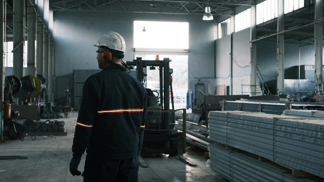 A skilled laborer looks over his shoulder