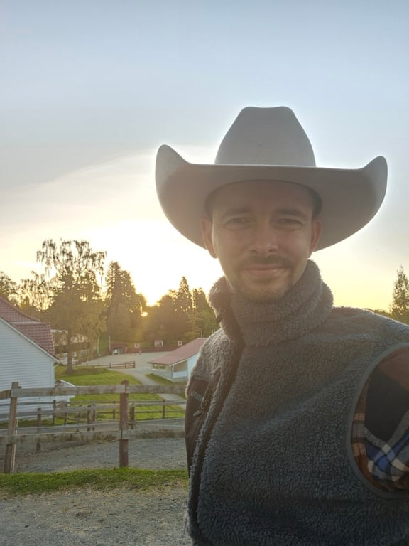 Me in a cowboy hat at Moldegaard stables