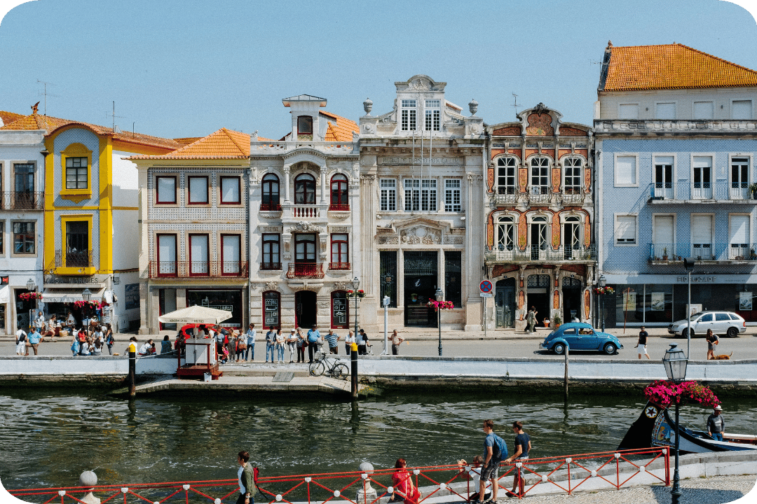 Vibrant street by a canal in Portugal.