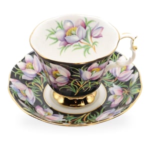 Royal Albert porcelain coffee cup and saucer with hand-painted floral design, close up of elegant vintage teacup set with gold accents