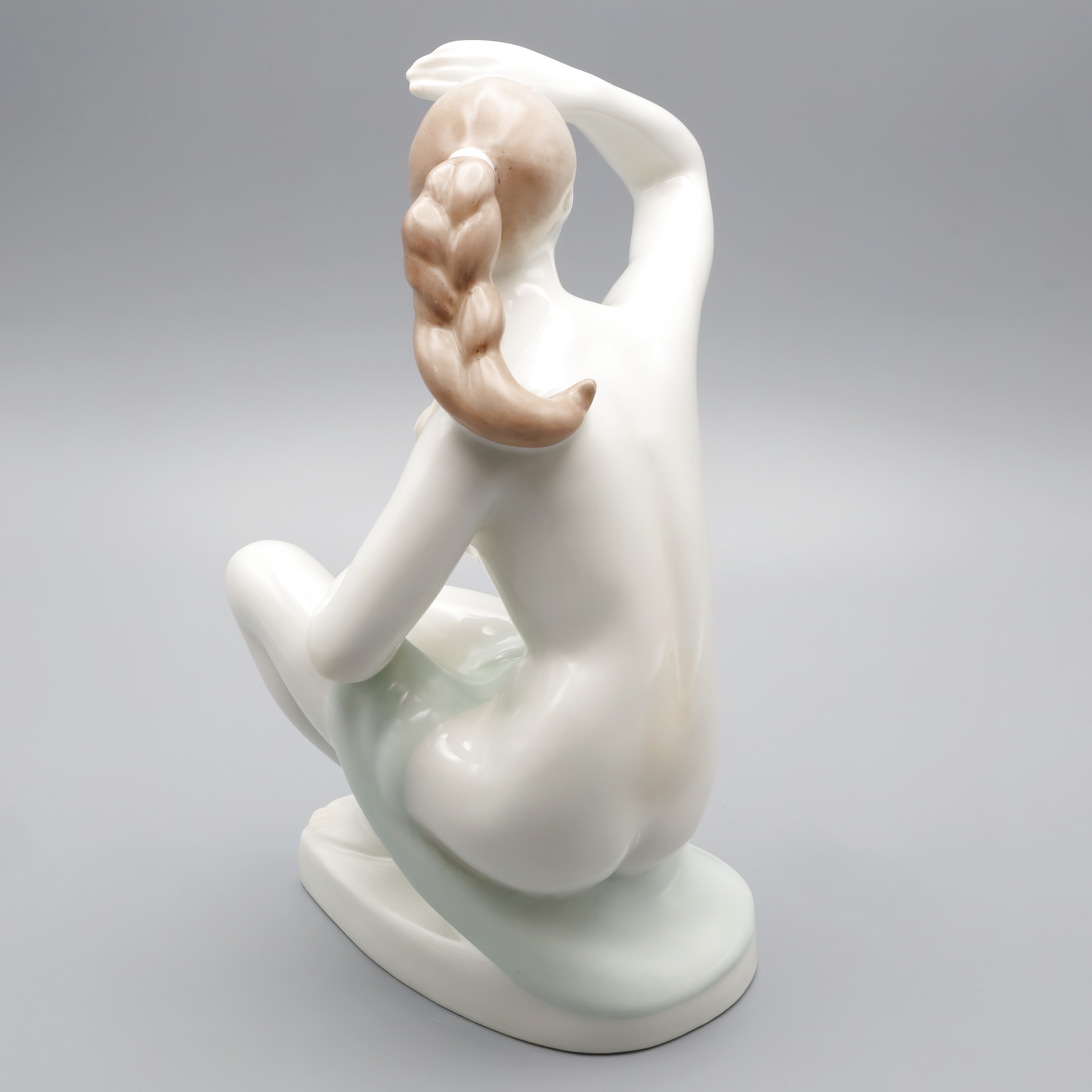 Elegant lady statue with braided hair, porcelain sculpture detailed back view, modern decorative art