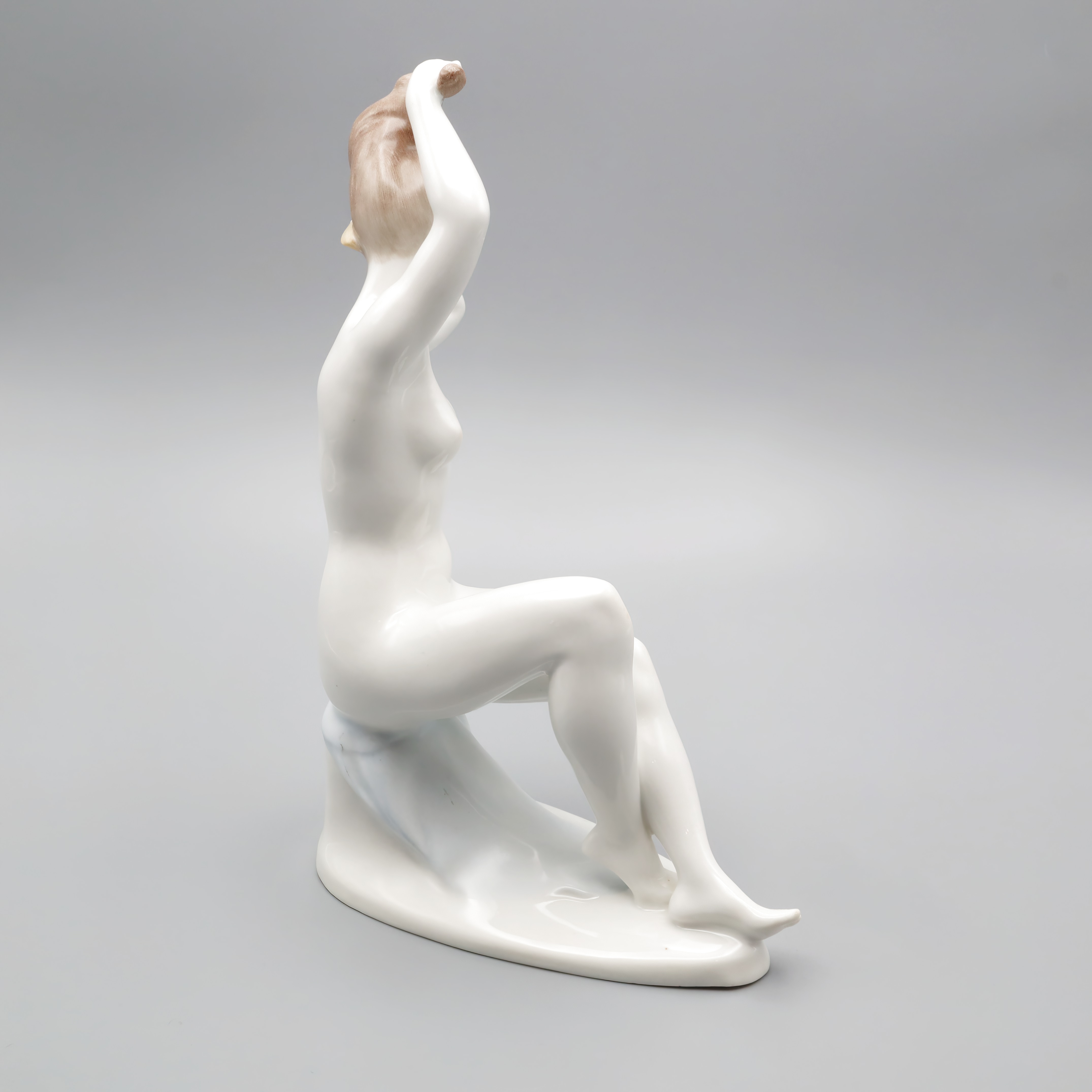 Nude Lady Figurine porcelain sculpture of a woman sitting with arms raised, elegant and artistic home decor