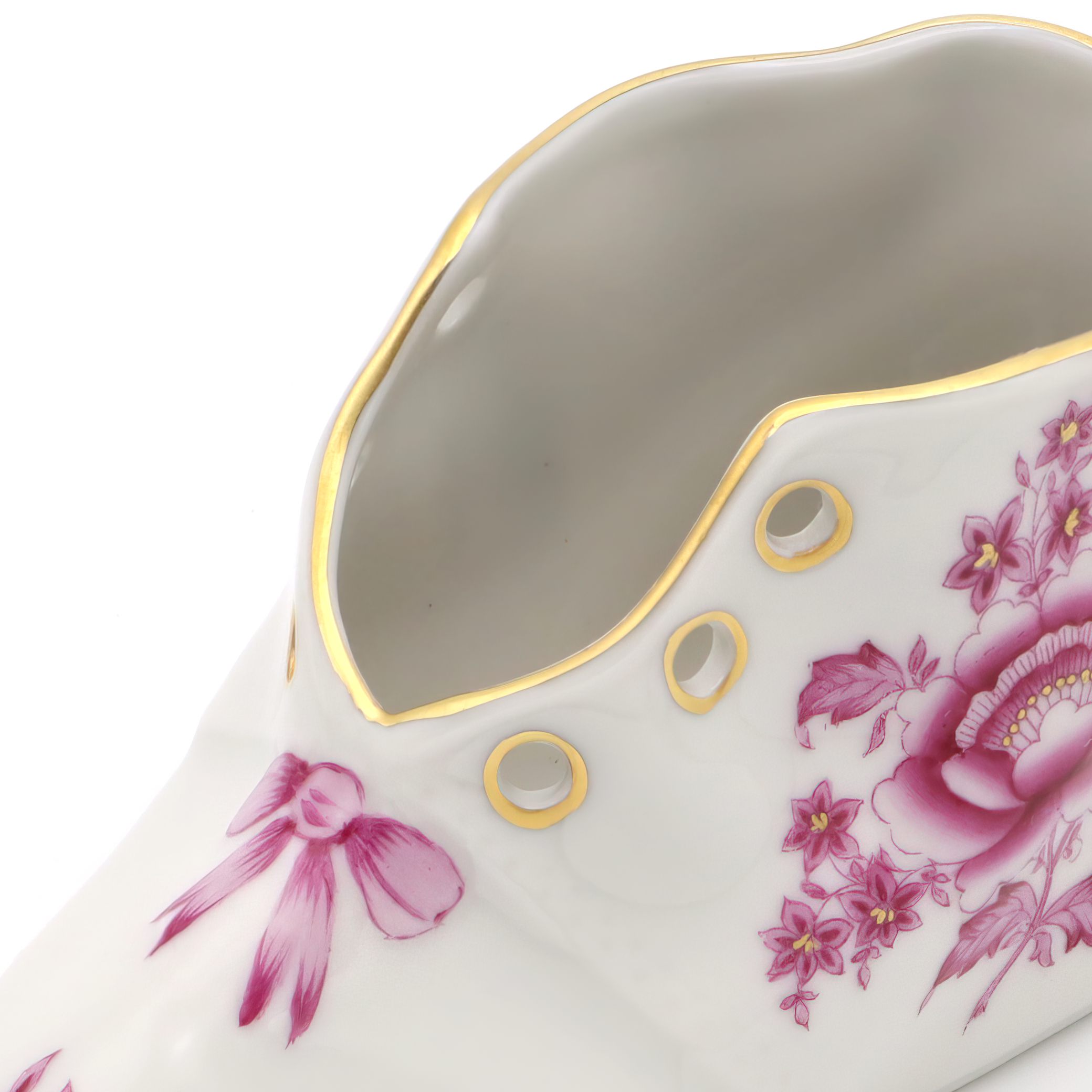 Herend vintage porcelain baby shoe close up with pink floral design and gold trim