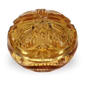 Amber glass trinket box with intricate cut design, close up of vintage decorative storage container