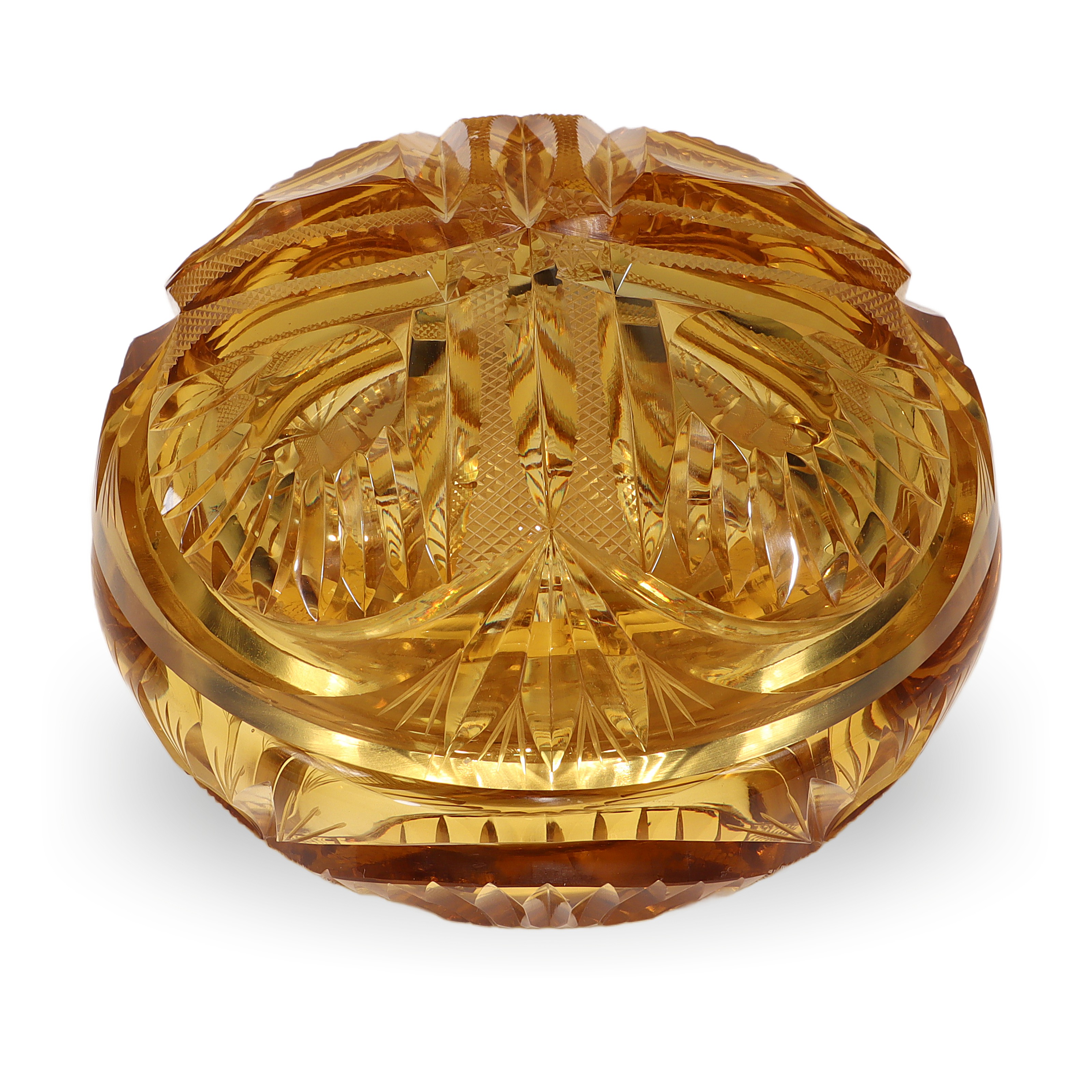 Amber glass trinket box with intricate cut design, close up of vintage decorative storage container