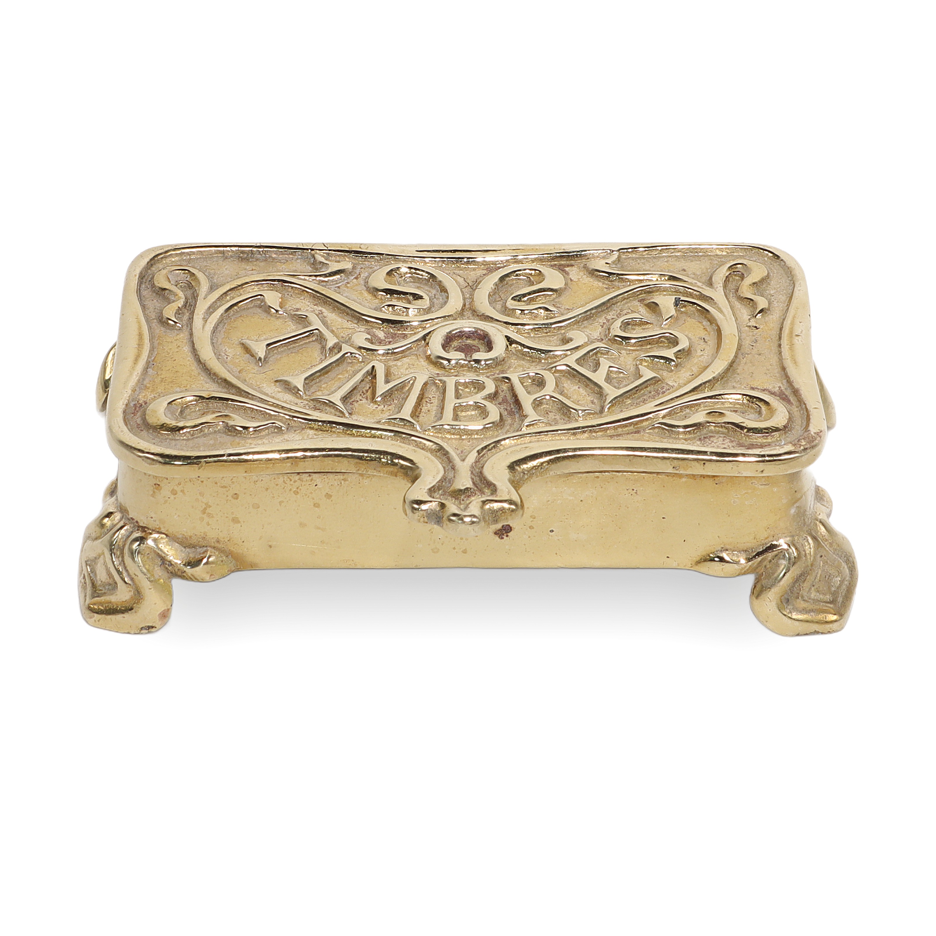 Brass stamp box vintage ornate design close up, antique collectible philately accessory
