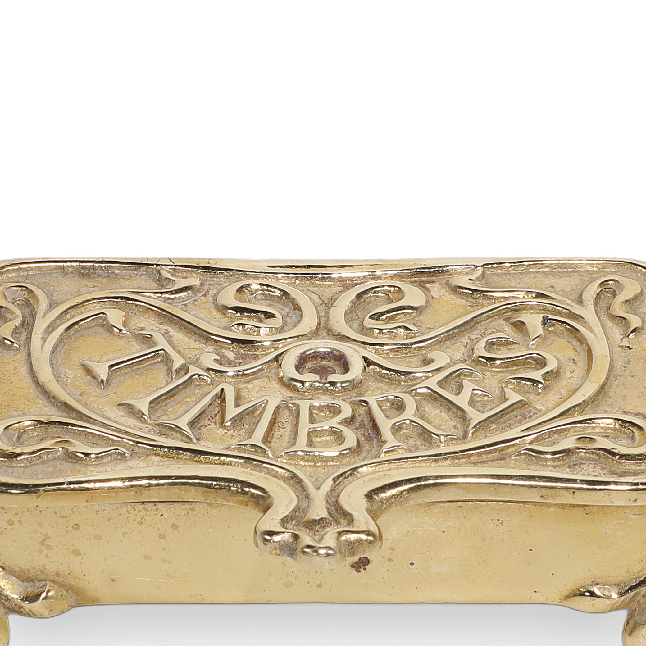 Brass stamp box close up with ornate vintage design and "Timbres" engraving