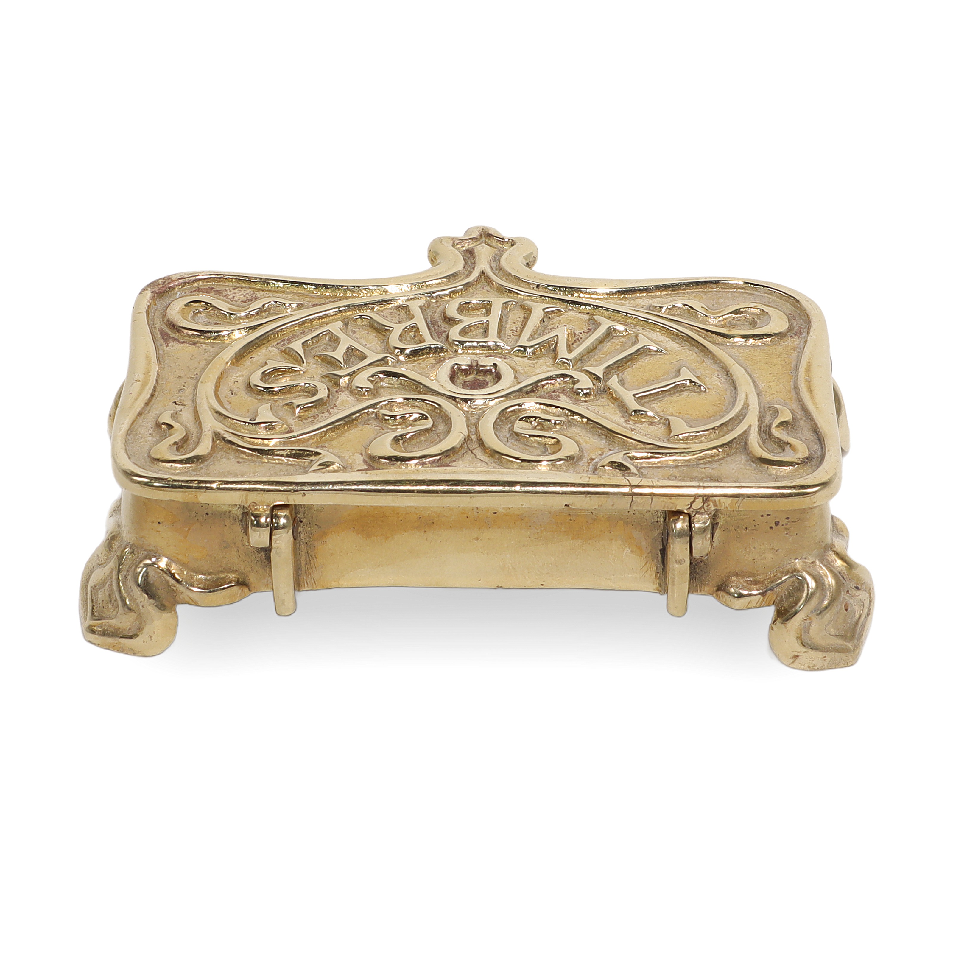 Brass stamp box ornate antique collectible with embossed lettering and decorative legs