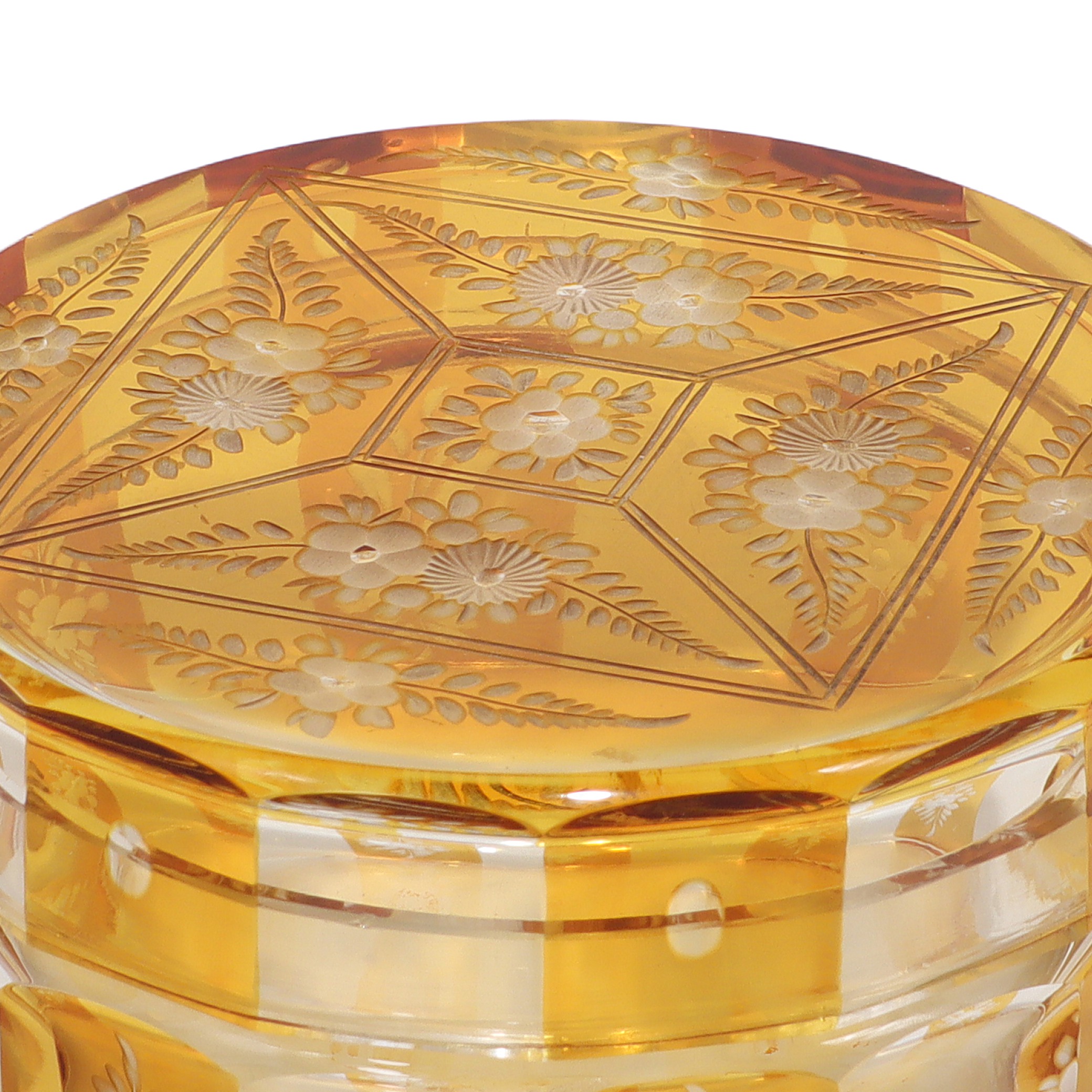 Bohemian amber cut glass trinket box close up, Art Deco floral engraved vintage collectible