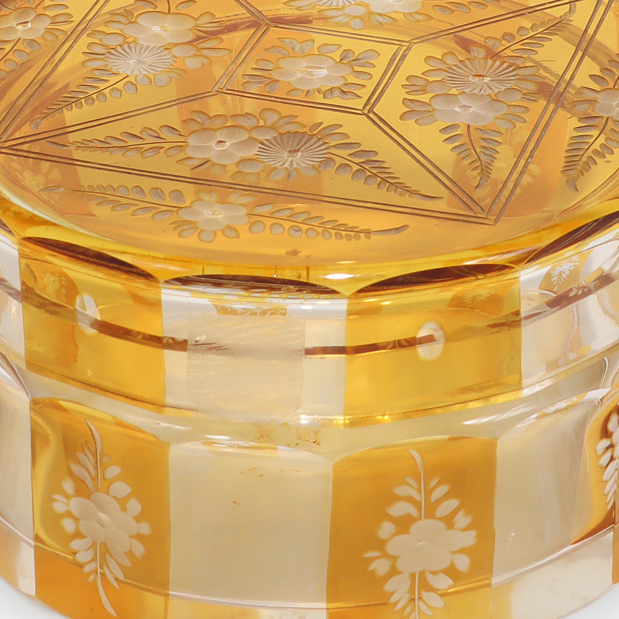 Bohemian amber cut glass trinket box close up, Art Deco floral engraved vintage collectible detailed view