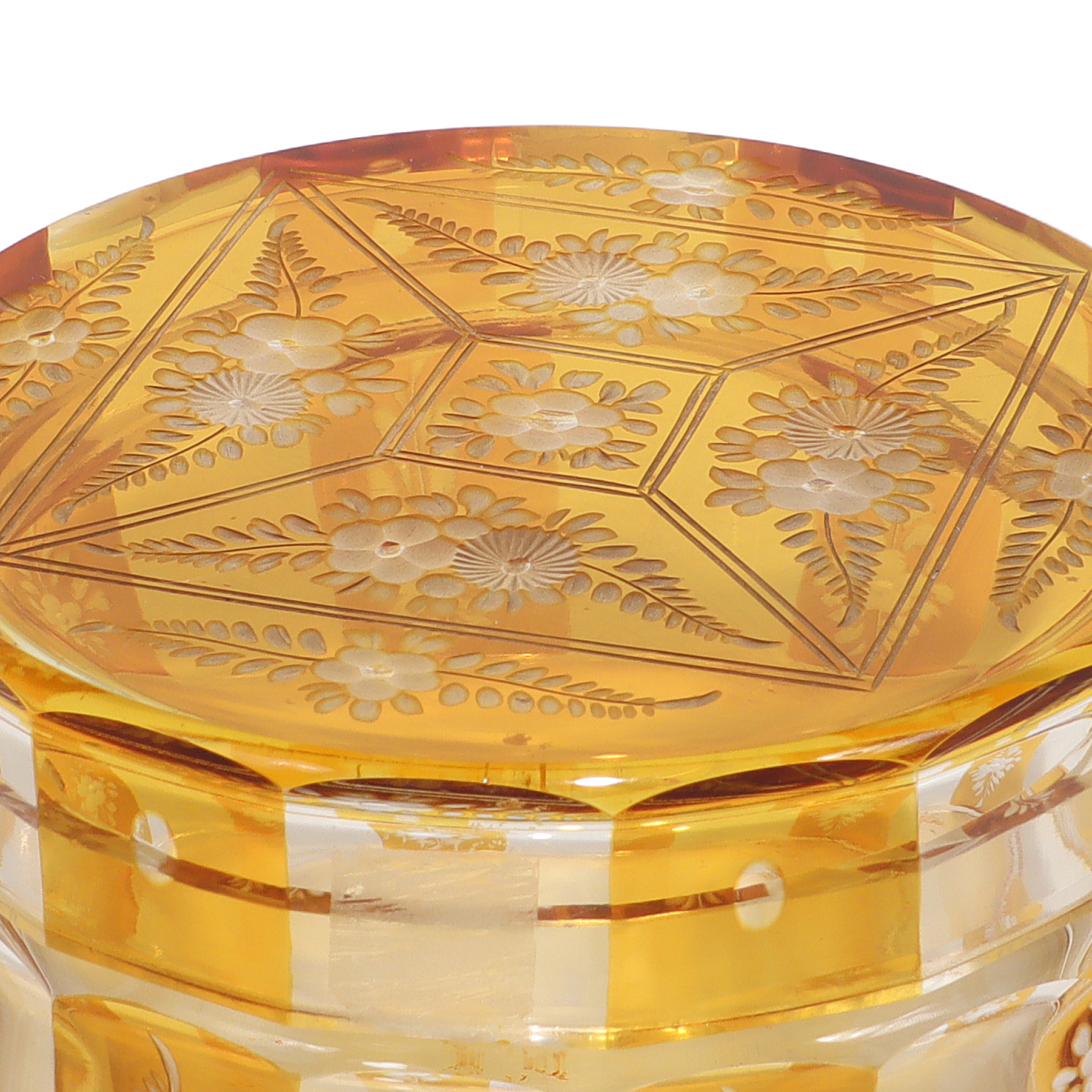 Bohemian amber cut glass trinket box detailed view with floral engraving, vintage Art Deco style