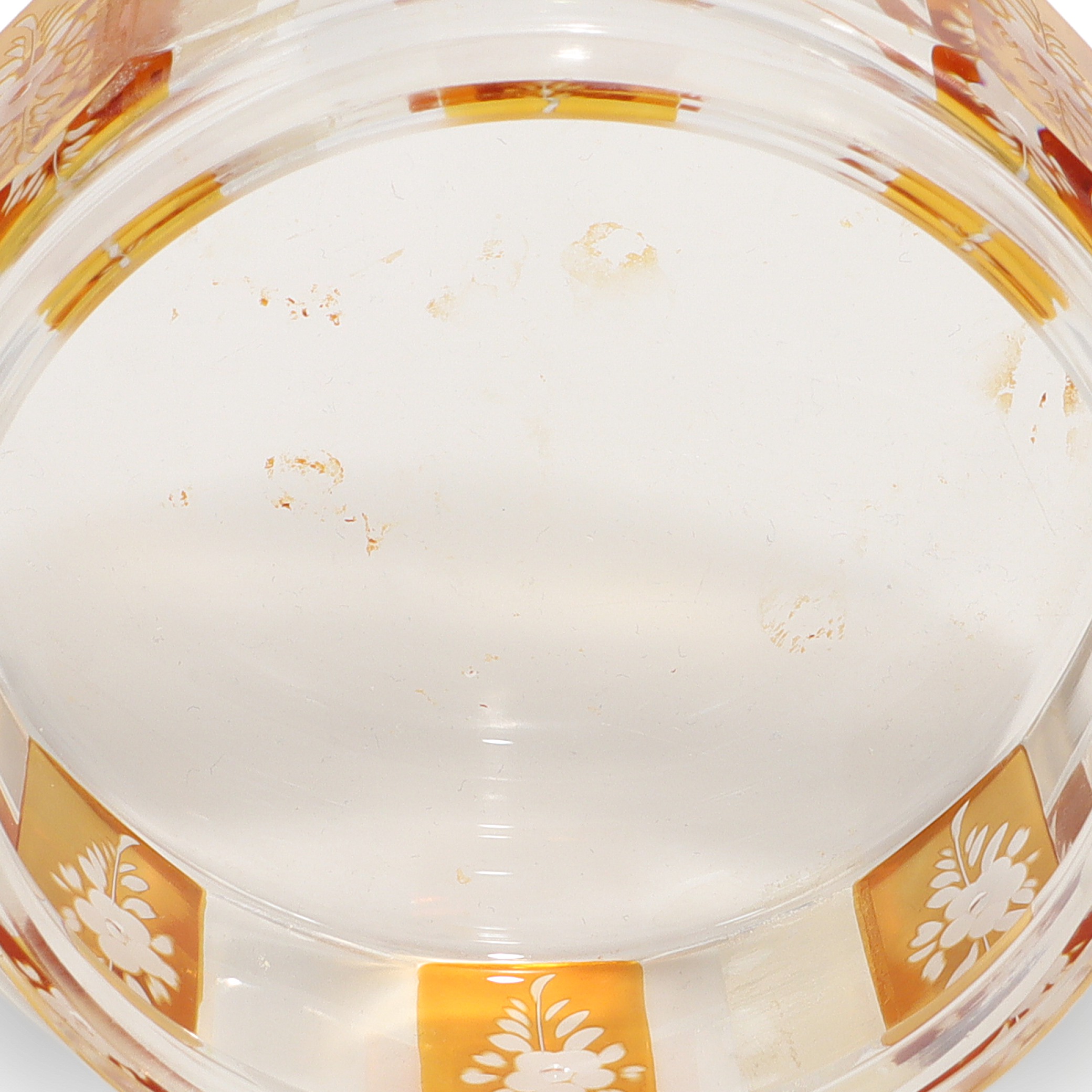 Bohemian amber cut glass trinket box base close up, vintage Art Deco floral engraved detail