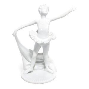 Art Deco porcelain ballerina figurine close up, elegant white ceramic ballet dancer collectible