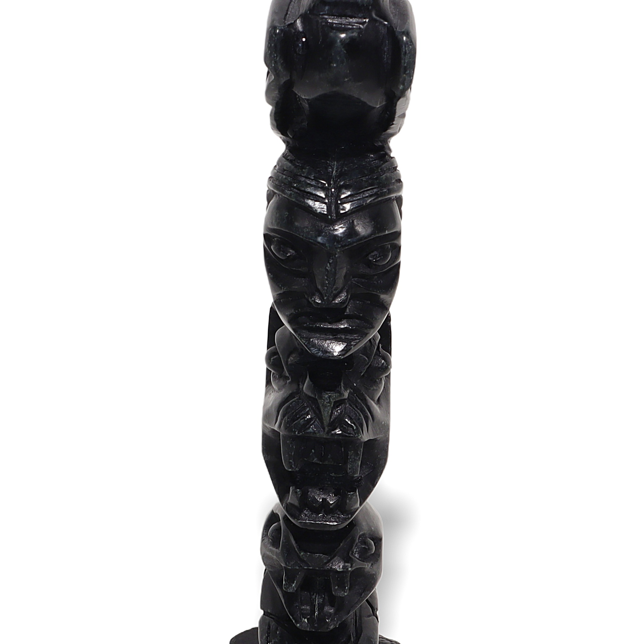 Stone totem pole sculpture close up, vintage carved tribal art, detailed face and animal figures