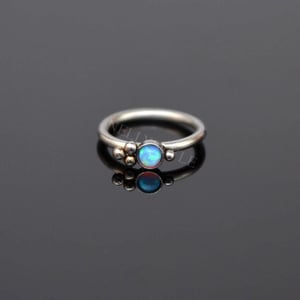 Elegant 18G Titanium Nose Ring with Opal Stone product image