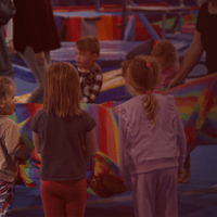 Kindy gymnasts playing with parachute