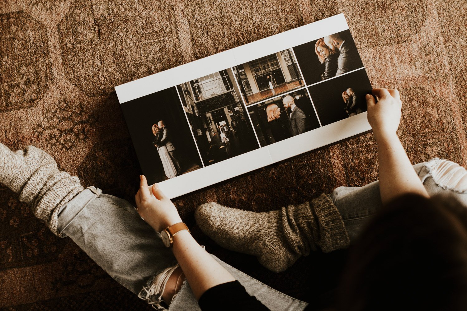 Couple flipping through wedding album