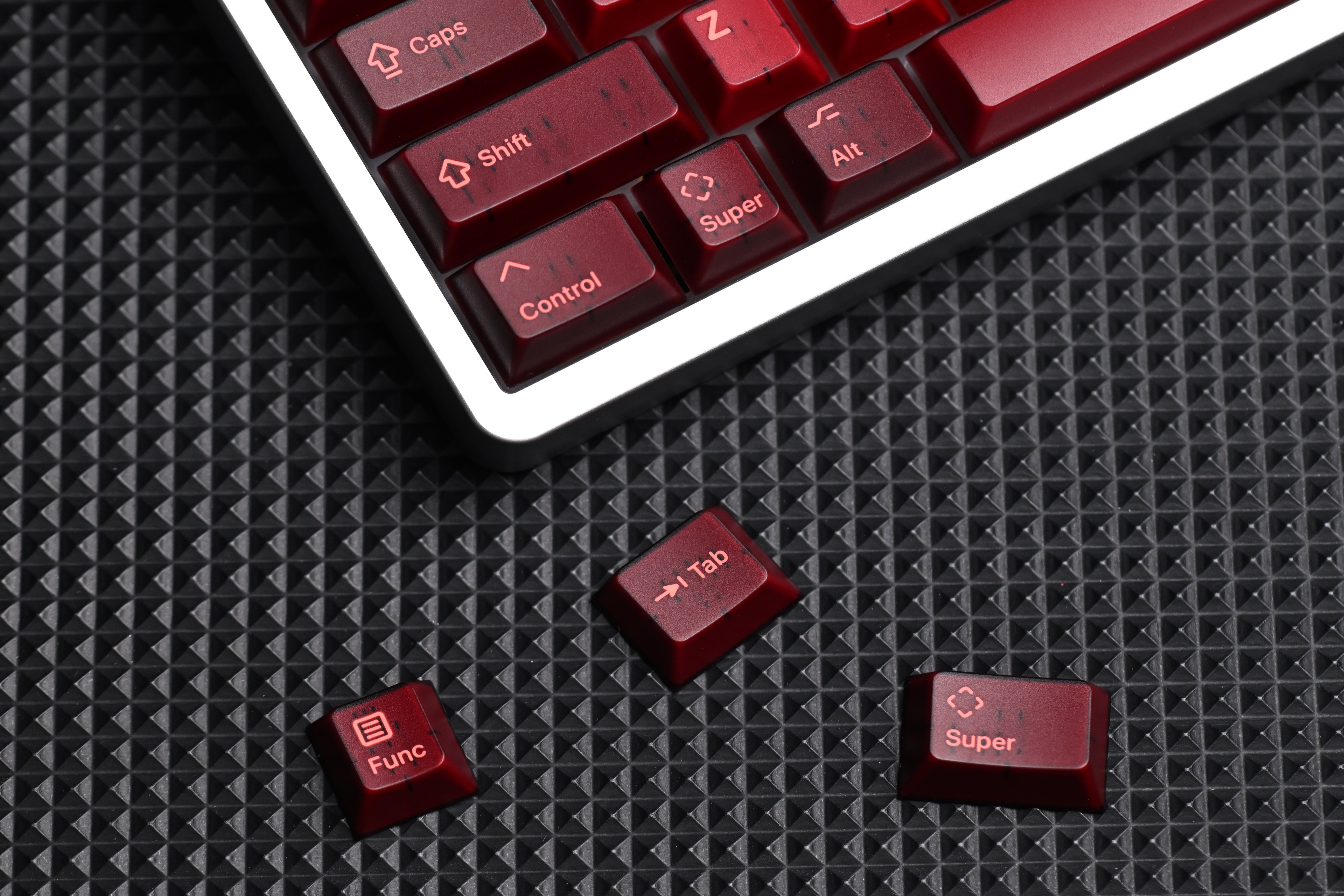 KAP Generation — a set of bright pink and translucent maroon keycaps image 9
