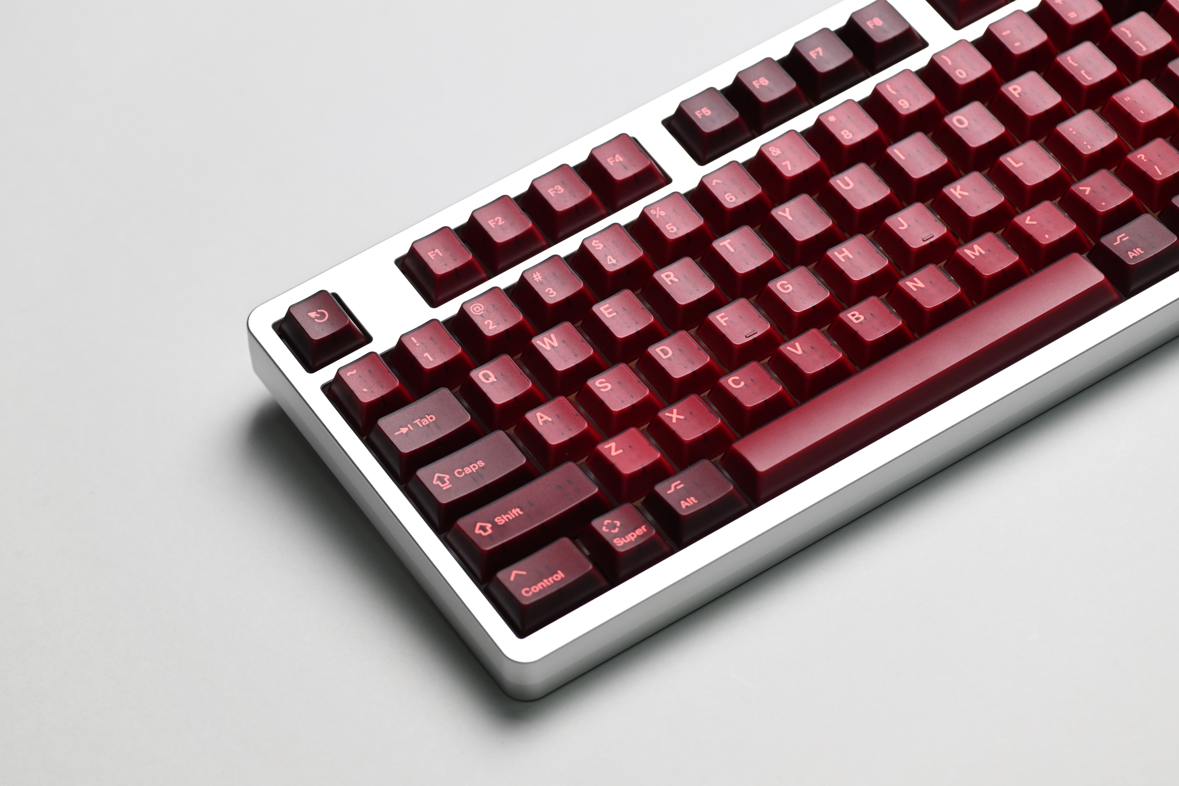 KAP Generation — a set of bright pink and translucent maroon keycaps image 2