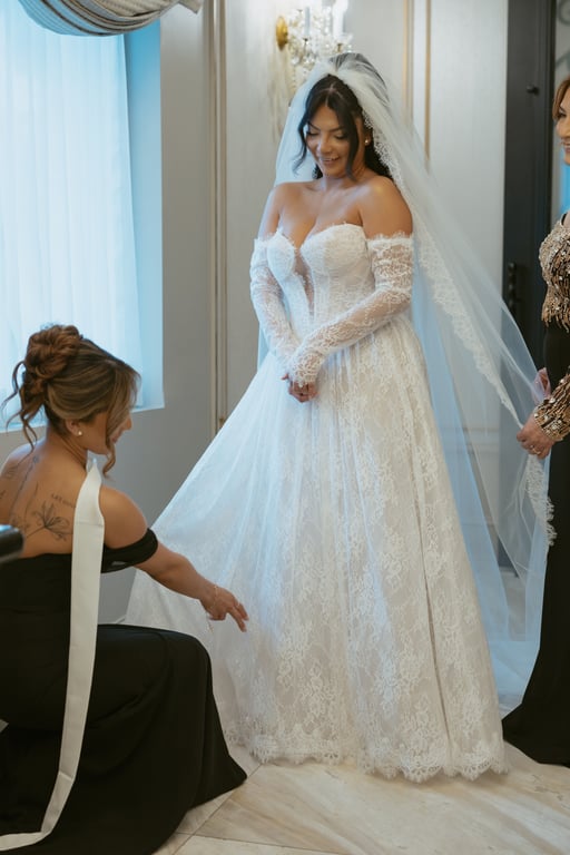 Bride smiling with bridesmaid