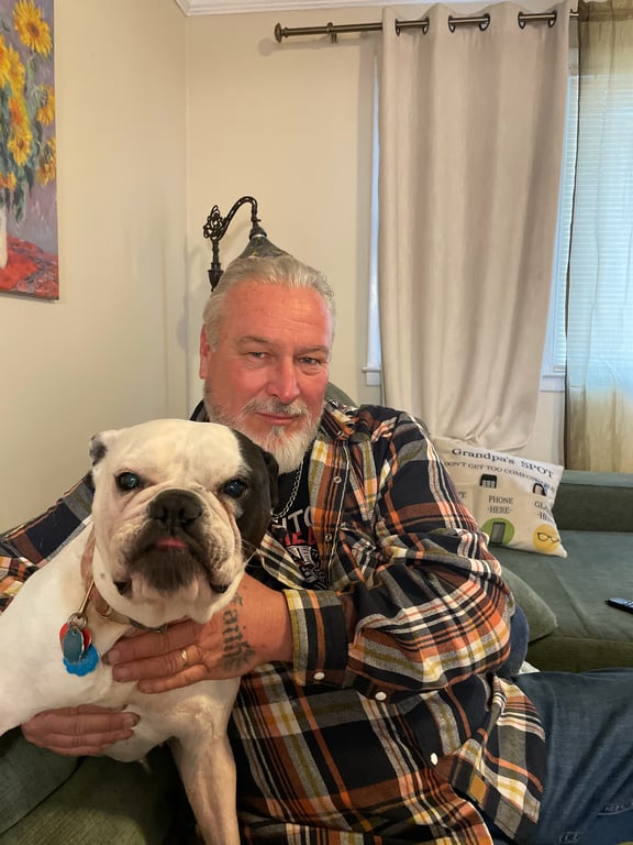 Chuck Loftus with Bella, Owner and Principal of Loftus Elite Roofing and GC Services