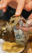 Artisan creating traditional Turkish mosaic lamp